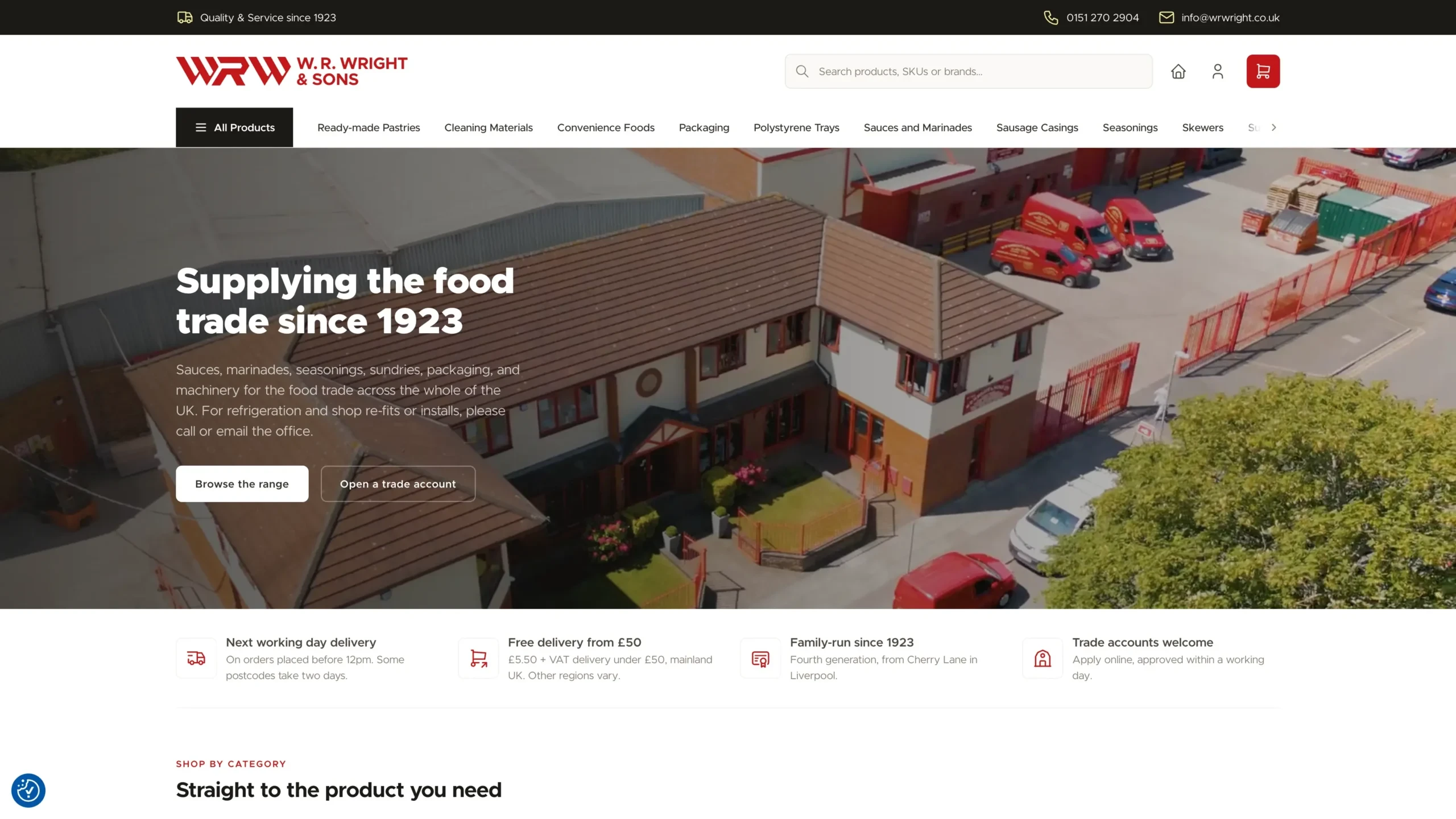 The W. R. Wright & Sons homepage shown on a tablet frame, with an aerial photo of the Liverpool depot behind the headline "Supplying the food trade since 1923", a delivery and trade account benefits bar, and a shop-by-category section below.
