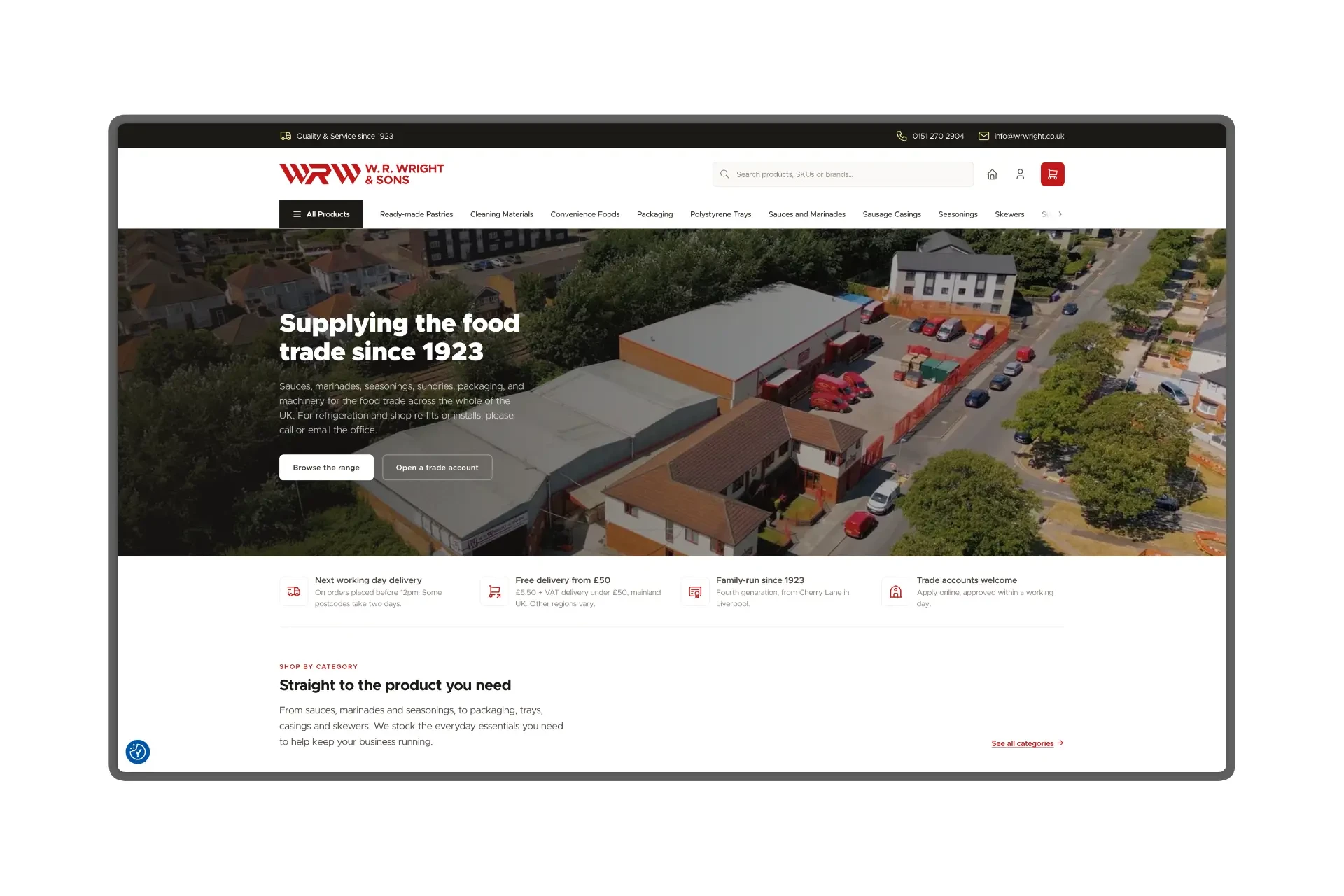 The W. R. Wright & Sons homepage shown on a tablet frame, with an aerial photo of the Liverpool depot behind the headline "Supplying the food trade since 1923", a delivery and trade account benefits bar, and a shop-by-category section below.